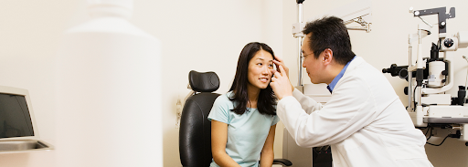 An eye specialist conducting a thorough vision examination on a patient