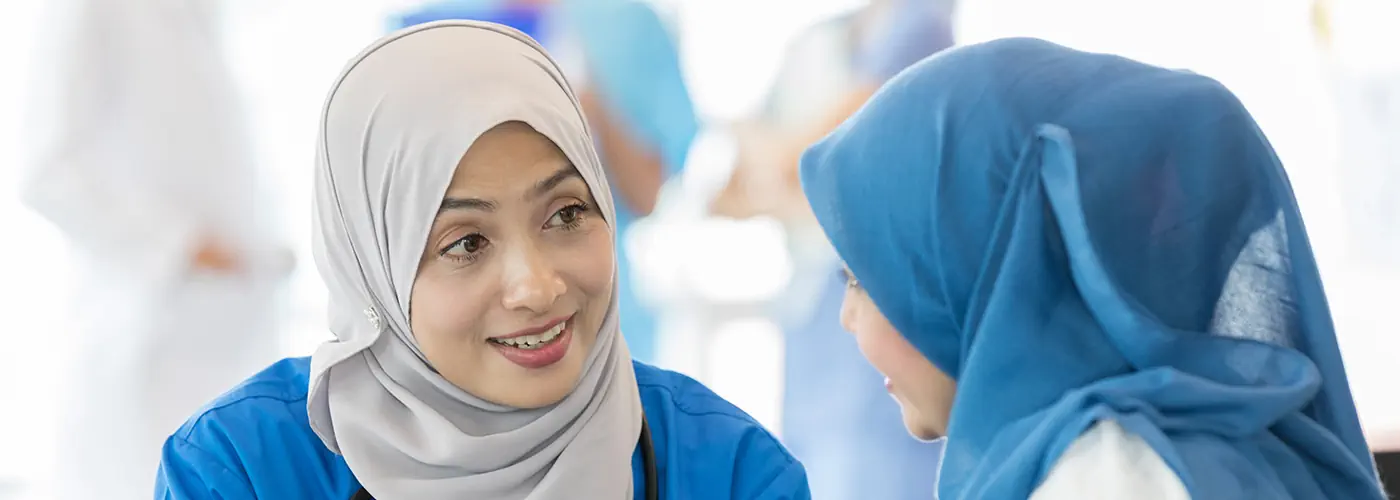 Gastroenterologist discussing colonoscopy procedure with a patient.