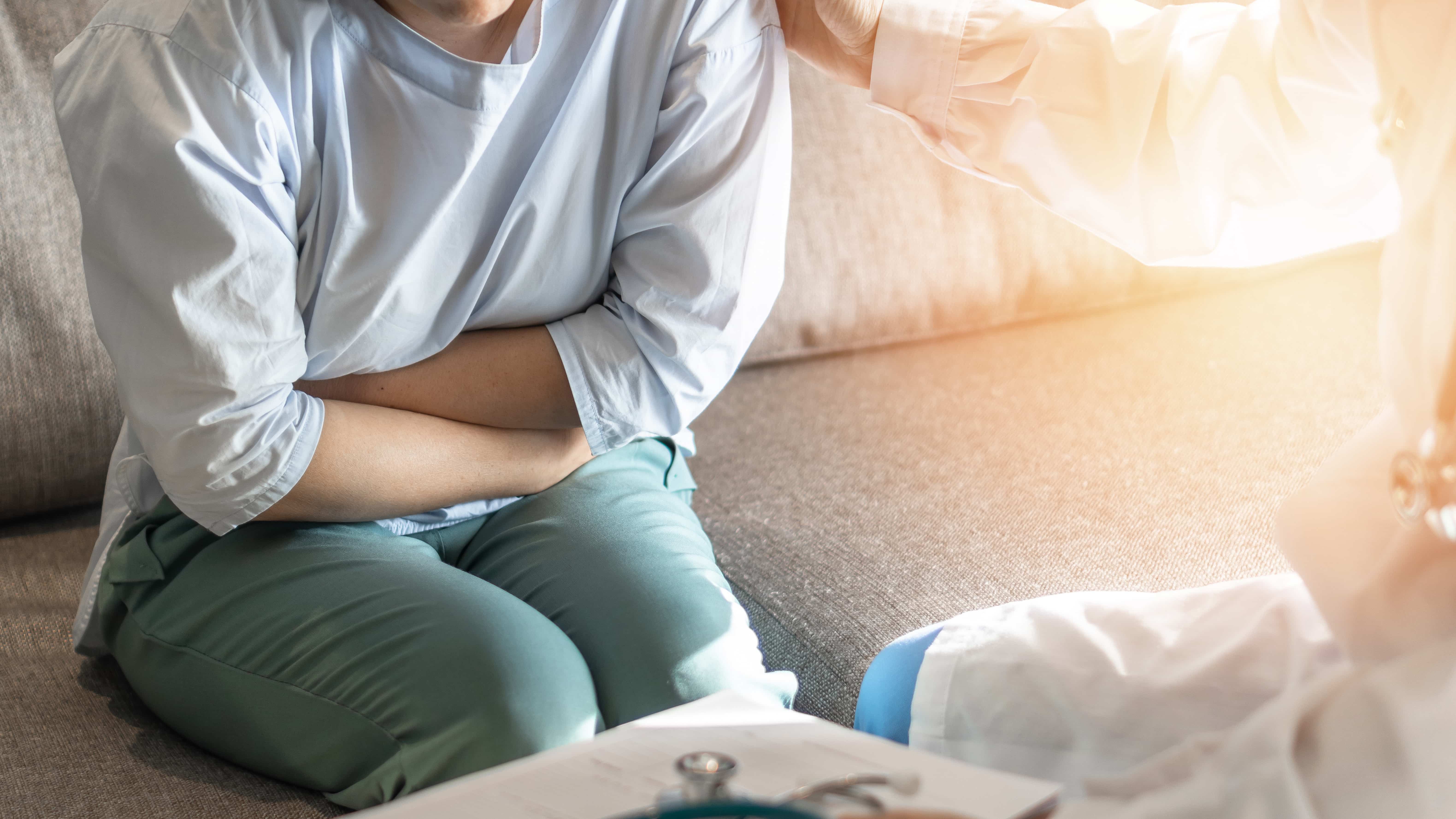 a person experiencing discomfort from a hernia